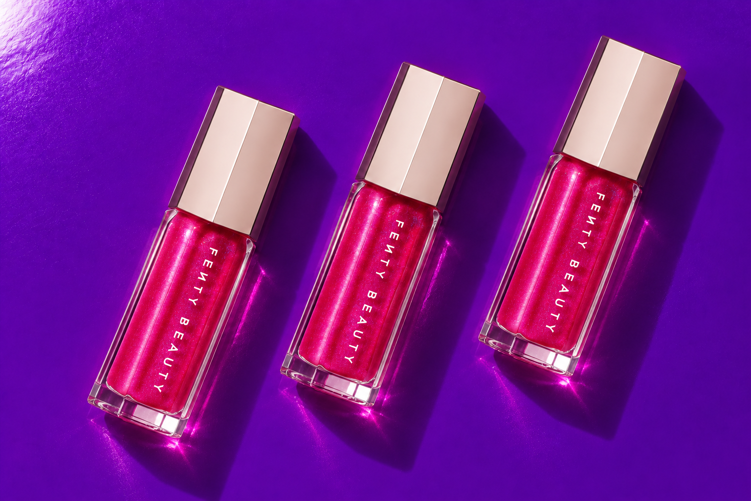 Fenty Beauty Gloss Bomb — Pink on violet